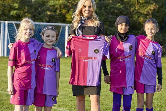 Harriet Walker with Chanterlands Girls Football Club players, from left, Evelyn Moult, Lilly Halliday, Rania Bilbas and Willow Gilligan.
