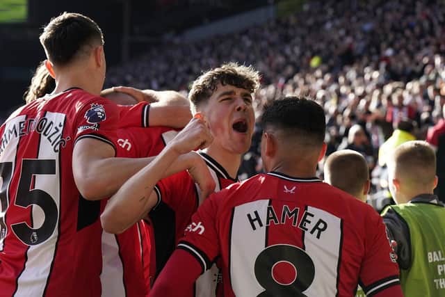 Oli Arblaster of Sheffield United joins in celebrating the first goal during the Premier League match against Fulham at Bramall Lane, Sheffield. Picture: Andrew Yates / Sportimage