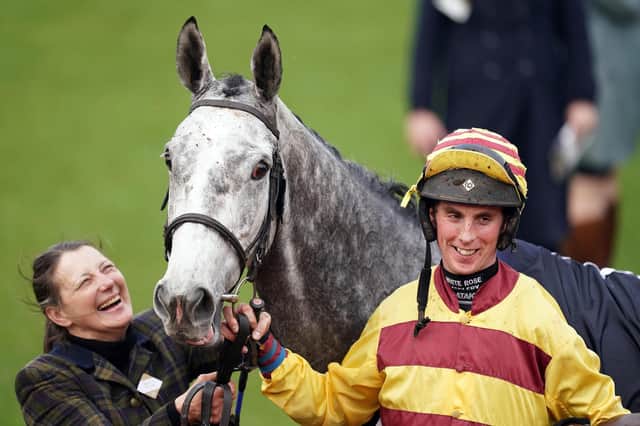Yorkshire Pride: Fiona Needham,left, and jockey John Dawson with Sine Nomine after the grey's victory in the St James' Place Festival Challenge Open Hunters' Chase at Cheltenham yesterday. (Picture: PA)