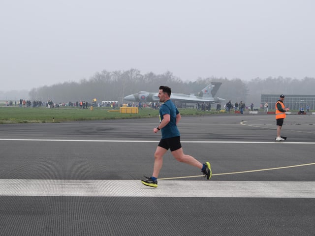 A runner takes flight at the Run The Runway event at Doncaster Sheffield Airport
