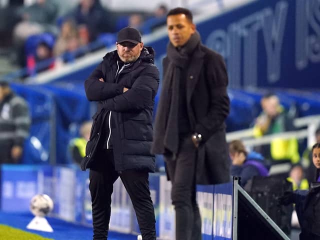 RIVALS: Birmingham City manager Wayne Rooney (left) and Hull City manager Liam Rosenior at St. Andrew's on Wednesday night. Picture: Jacob King/PA