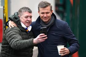 Former Leeds United manager Jesse Marsch (right) takes a photo with a fan ahead of the Emirates FA Cup fourth round match at the Wham Stadium, Accrington in January