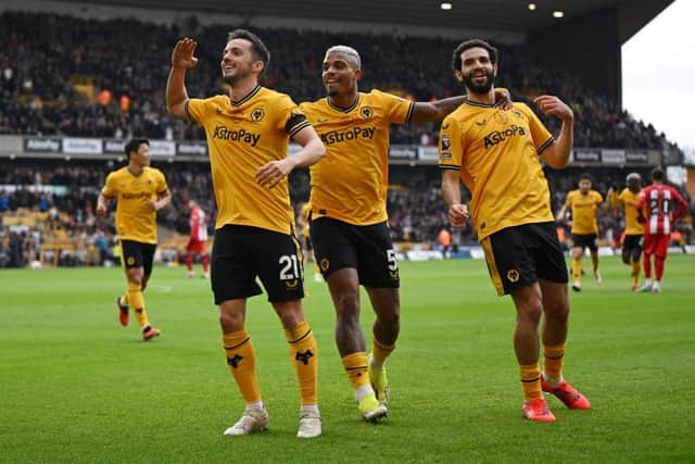 GOAL: Pablo Sarabia (left) celebrates putting Wolverhampton Wanderers in front