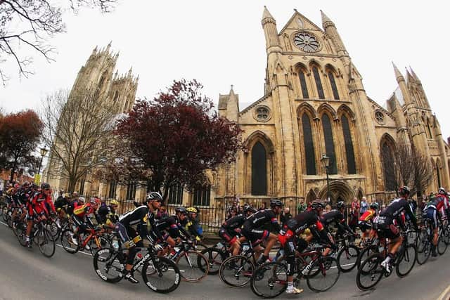 The peloton ride past Beverley Cathedral on stage 2 of the Tour de Yorkshire from Selby to York in May 2015. (Pic credit: Bryn Lennon / Getty Images)