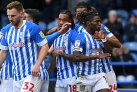 UP AND RUNNING: Joseph Hungbo celebrates Huddersfield Town's first goal of Neil Warnock's second spell, and the on-loan winger's first for the club.
