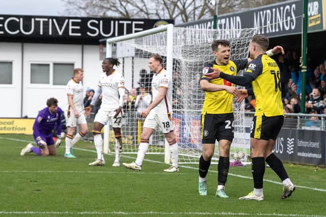 Harrogate Town's Josh March and Jack Muldoon celebrate after Bradford City defender Daniel Oyegoke's own goal to make it 3-0 to the hosts on League Two derby day. Picture: Tony Johnson.