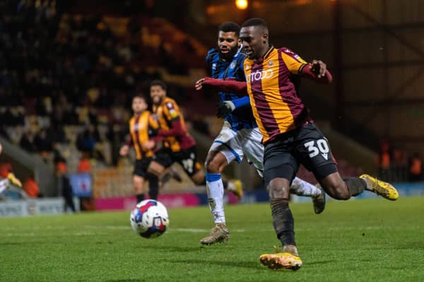 Bradford City goalscorer Abo Eisa and Rochdale captain Ethan Ebanks-Landell chase the ball in Tuesday's game. Picture: Bruce Rollinson