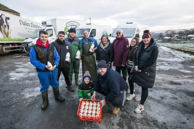 Leon Parrott, Reuben Sykes, Liam Dodson, Karl Fairbank, Bronwyn Kershaw, Stephen Kershaw, Harriet Sykes, and Sarah Sykes, with Hugo Sykes, six, and Chris Sykes at the front. They all work at Shroggs Farm in Halifax.