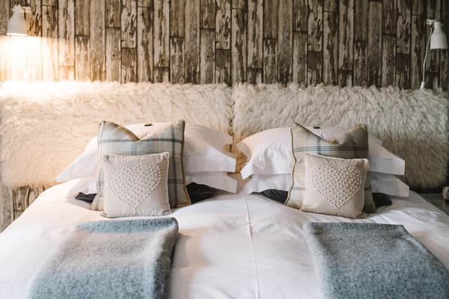 The headboard in the guest annexe is covered with sheepskin rugs