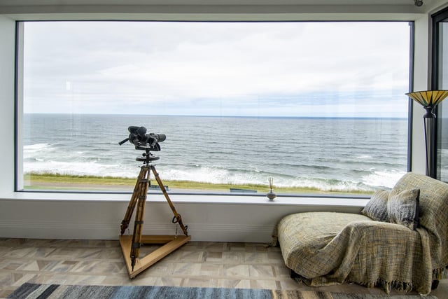 A picture window in  the  upstairs living area delivers an amazing sea view.