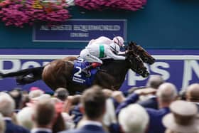 CLOSE-RUN THING: James Doyle riding Warm Heart (in pink) hold on from Frankie Dettori and Free Wind (white/green) to win The Pertemps Network Yorkshire Oaks at York on Thursday afternoon Picture: Alan Crowhurst/Getty Images