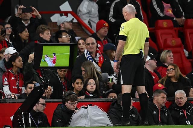 HAVE A LOOK: Paul Tierney reviews Lisandro Martinez's challenge with Dominic Calvert-Lewin before sending the Argentinian off for hair pulling (Image: Paul ELLIS / AFP via Getty Images)