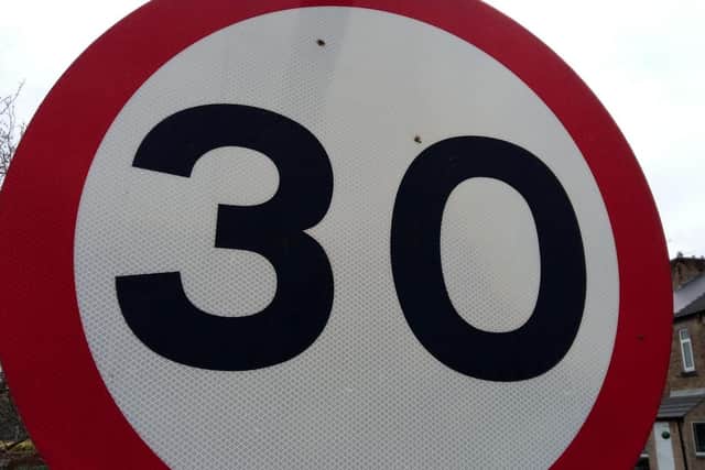A 30mph speed limit sign.