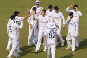 Matt Fisher, centre, is congratulated by England Lions team-mates for one of his four wickets on Thursday (Picture: ECB)