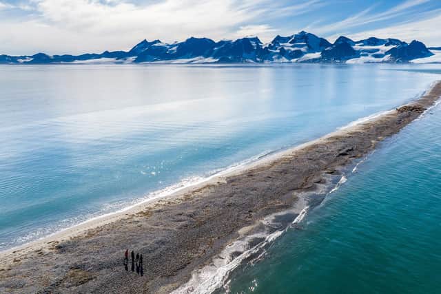 A drone shot shows the team from BAS and WWF approaching a walrus haul-out on a spit in Svalbard, Norway. Image: Emmanuel Rondeau / WWF-UK