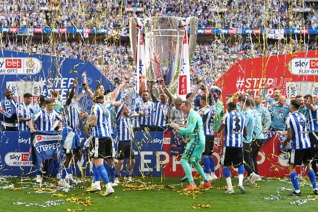 Sheffield Wednesday players celebrate with the trophy and promotion to the Sky Bet Championship following victory in the Sky Bet League One play-off final at Wembley Stadium, London. Picture date: Monday May 29, 2023. PA Photo. See PA story SOCCER Final. Photo credit should read: Nick Potts/PA Wire.

RESTRICTIONS: EDITORIAL USE ONLY No use with unauthorised audio, video, data, fixture lists, club/league logos or "live" services. Online in-match use limited to 120 images, no video emulation. No use in betting, games or single club/league/player publications.