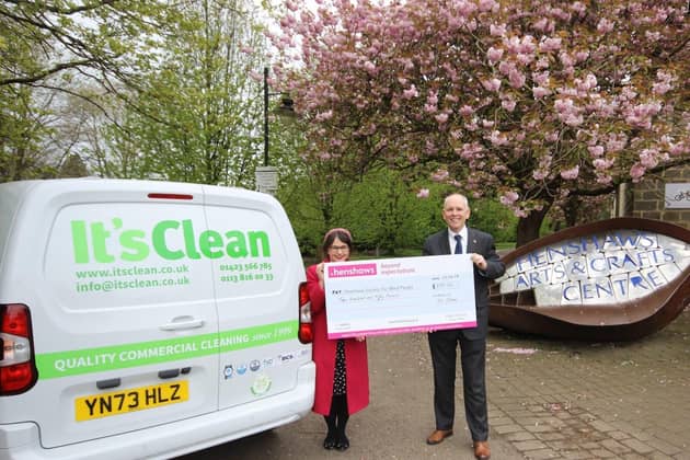 David Whan of It's Clean Ltd presenting the latest charity donation to Henshaws