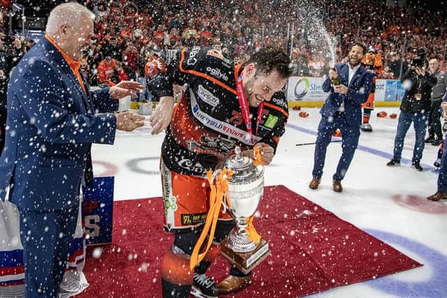CHAMPION MOMENT: Sheffield Steelers Robert Dowd lifts the Challenge Cup trophy after beating the Guildford Flames on March 13 at the Utilita Arena. Picture: Tony Johnson