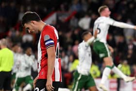 HEADING OUT: Sheffield United's John Egan shows his dismay after missing his side's fifth and final penalty in the shoot-out against Lincoln City at Bramall Lane Picture: Ross Kinnaird/Getty Images