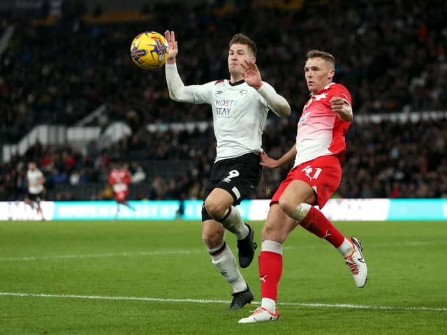 Derby County's James Collins (left) and Barnsley's Jack Shepherd battle for the ball during the Sky Bet League One match in November. Picture: Barrington Coombs/PA Wire.