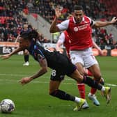 Rotherham United midfielder Andy Rinomhota challenges Huddersfield Town rival David Kasumu in the recent Championship derby at the AESSEAL New York Stadium. Picture: Jonathan Gawthorpe.