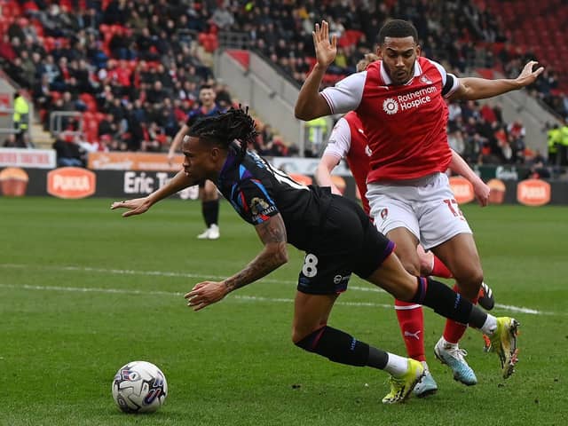 Rotherham United midfielder Andy Rinomhota challenges Huddersfield Town rival David Kasumu in the recent Championship derby at the AESSEAL New York Stadium. Picture: Jonathan Gawthorpe.