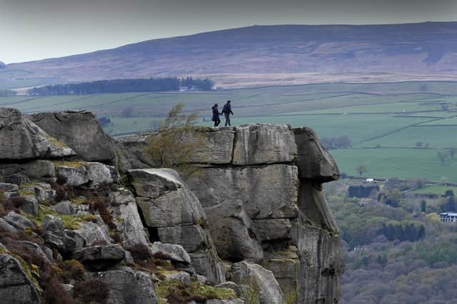 Walkers are pictured on the Cow and Calf Rocks, Ilkley. (Pic credit: Simon Hulme)