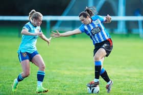 Stalwart: Beth Stanfield, right, in action for Huddersfield Town Women who she has helped take back to the top of the third tier.