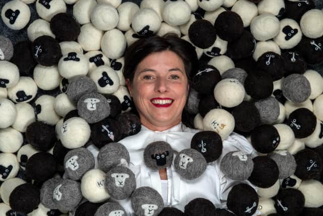 Sarah Turner surrounded by the finished products of eco friendly tumble dryer balls in the shape of sheep. (Pic credit: Bruce Rollinson)