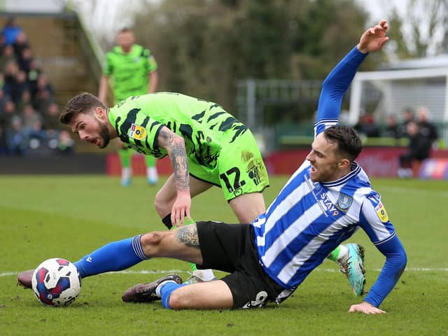 Tangled up: Sheffield Wednesday's Lee Gregory, right, and Forest Green Rovers' goalscorer Jordon Garrick challenge for the ball (Picture: Nigel French/PA Wire)