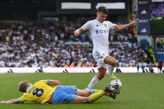 DETERMINED: Sheffield Wednesday's George Byers tackles Jamie Shackleton of Leeds United