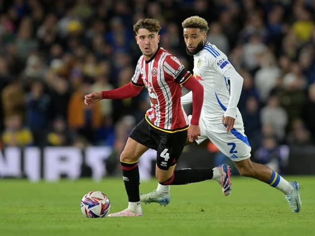 Sheffield United captain Ollie Arblaster is pursued by former team-mate and current Leeds United defender Jayden Bogle during the Championship derby game at Elland Road in October. Picture: Bruce Rollinson.