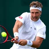 COMING THROUGH: Britain's Liam Broady plays a backhand down the line during his first round singles victory against Constant Lestienne at Wimbledon. Picture: Steven Paston/PA