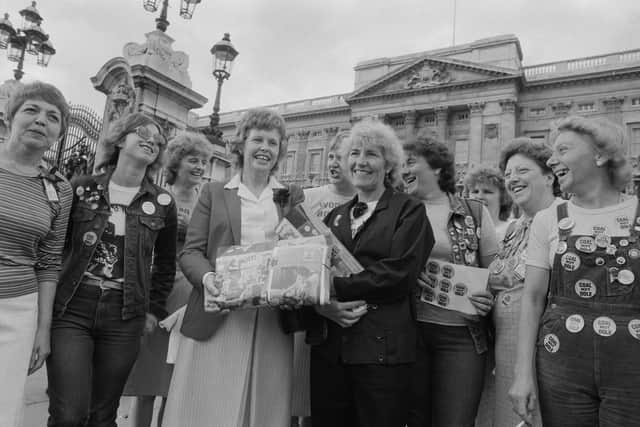 Betty Heathfield and Anne Scargill with other miners' wifes hold a petition in support of the miners' strike, which was presented at Buckingham Palace