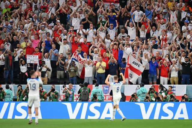 AL KHOR, QATAR - DECEMBER 04: England fans celebrate after the team's victory during the FIFA World Cup Qatar 2022 Round of 16 match between England and Senegal at Al Bayt Stadium on December 04, 2022 in Al Khor, Qatar. (Photo by Dan Mullan/Getty Images)