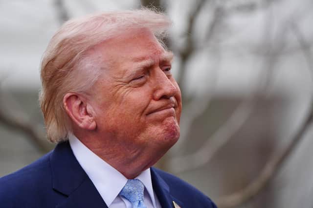 President Donald Trump speaks with reporters. PIC: AP Photo/Alex Brandon
