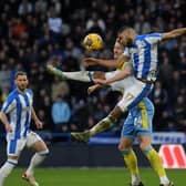 Huddersfield Town and Northern Ireland defender Brodie Spencer challenges Sheffield Wednesday's Michael Smith in the recent Championship fixture at the John Smith's Stadium. Picture: Jonathan Gawthorpe.