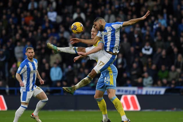 Huddersfield Town and Northern Ireland defender Brodie Spencer challenges Sheffield Wednesday's Michael Smith in the recent Championship fixture at the John Smith's Stadium. Picture: Jonathan Gawthorpe.