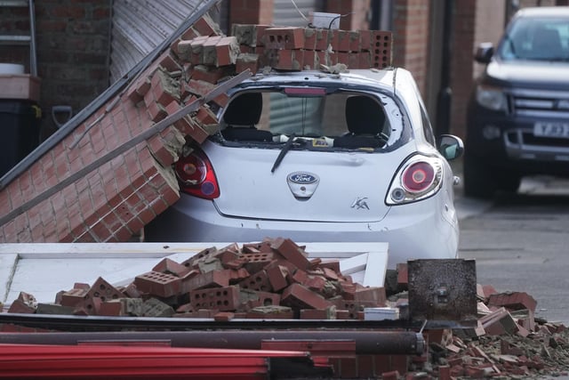 A brick wall fallen on a car in Cullercoats, North Tyneside, thanks to the strong gusts brought by Storm Jocelyn.