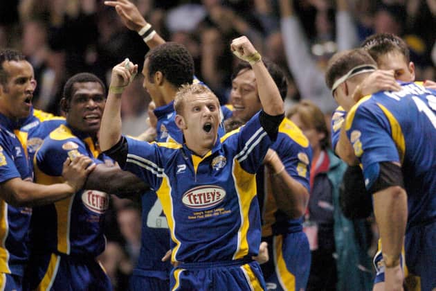 A champion: Rob Burrow celebrates winning the Super League Grand Final with Leeds Rhinos against Bradford Bulls back in 2004. Tributes have been pouring in since his death was announced on Sunday. (Picture: Steve Riding)