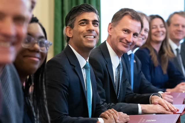 Prime Minister Rishi Sunak poses for a photograph alongside Chancellor of the Exchequer Jeremy Hunt, centre right. PIC: STEFAN ROUSSEAU/POOL/AFP via Getty Images
