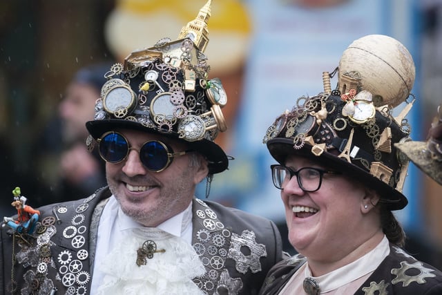 A couple were wearing very detailed hats as part of their costumes.