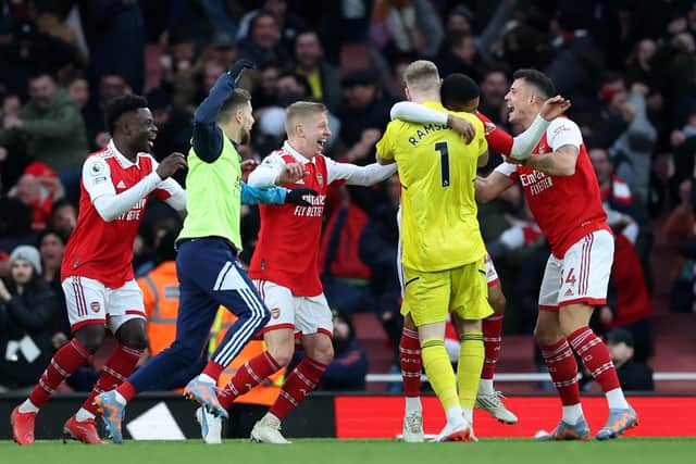 LONDON, ENGLAND - MARCH 04: Reiss Nelson of Arsenal (obscured) celebrates with teammates Bukayo Saka, Oleksandr Zinchenko, Aaron Ramsdale, Granit Xhaka after scoring the team's third goal during the Premier League match between Arsenal FC and AFC Bournemouth at Emirates Stadium on March 04, 2023 in London, England. (Photo by Julian Finney/Getty Images)