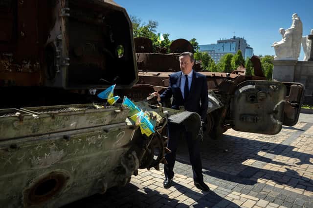 Foreign Secretary Lord David Cameron walks past a display of destroyed Russian military vehicles in Saint Michael's Square during his visit to Kyiv in Ukraine. PIC: Thomas Peter/PA Wire