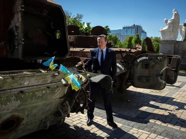 Foreign Secretary Lord David Cameron walks past a display of destroyed Russian military vehicles in Saint Michael's Square during his visit to Kyiv in Ukraine. PIC: Thomas Peter/PA Wire