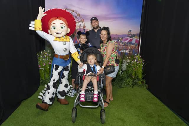 Lillia and her family meet Jessie at ‘A Disney Wish’.  Photo credit: Dominic Lipinski/Getty Images