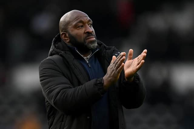 DERBY, ENGLAND - DECEMBER 03: Sheffield Wednesday manager Darren Moore salutes the fans after the Sky Bet League One between Derby County and Sheffield Wednesday at Pride Park Stadium on December 03, 2022 in Derby, England. (Photo by Gareth Copley/Getty Images)
