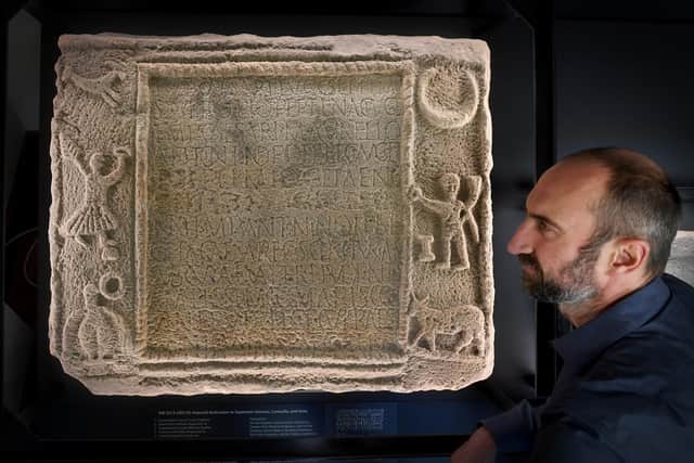 Dr Samuel Gartland pictured with the  Ancient Dales Inscription Stone found at Bainbridge. The stone is on show at Leeds University. Picture by Simon Hulme 17th October 2022










