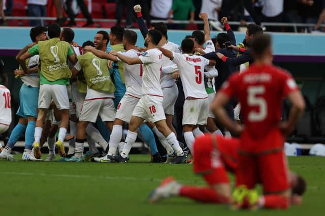 Iran's players celebrate their victory during the Qatar 2022 World Cup Group B football match between Wales and Iran at the Ahmad Bin Ali Stadium in Al-Rayyan (Picture: ADRIAN DENNIS/AFP via Getty Images)
