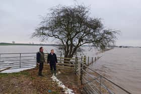 Farmer Nigel Watson and Robbie Moore MP survey flood damage to farmland in East Yorkshire.